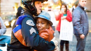 This photo of a Portland, Ore., police officer hugging Devonte Hart, a young student who was holding up a "Free Hugs" sign during a Ferguson protest in Portland.
